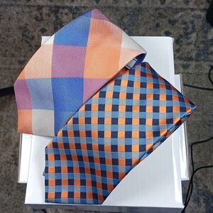 Pair of orange and blue‎ polyester Izod ties.